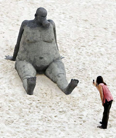 Sydney, Australia: A sculpture is photographed by a visitor to Tamarama beach