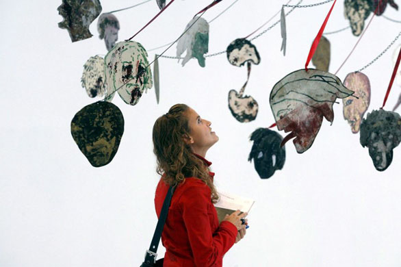 Madrid, Spain: A woman looks at the art work 'Maypole. Take No Prisoners' by Nancy Spero at Reina Sofia Museum