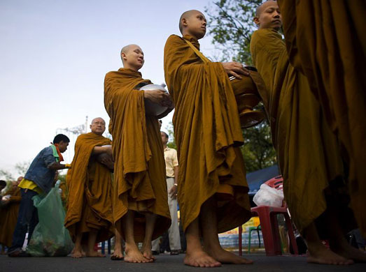 Bangkok, Thailand: Buddhist monks accept offerings from supporters of the People's Alliance for Democracy