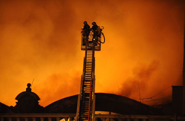 Prague, Czech Republic: Firefighters try to extinguish a fire at the Industrial Palace Fairgrounds