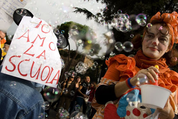Rome, Italy: A woman blows bubbles during a public sector strike