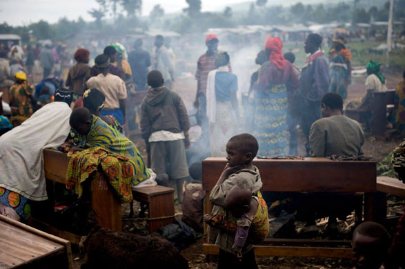 Kibati, Democratic Republic of Congo: People gather in an improvised Internally Displaced People (IDP) camp