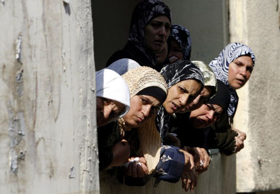 al-Yamoun village, West Bank: Women watch the funeral of Mohammed Abahereh