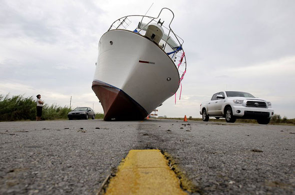 Fort Pike, Louisiana: A 35-foot-long fishing boat rests on the centre of Highway 90 after being washed up from a boat yard when when Hurricane Gustav hit the area