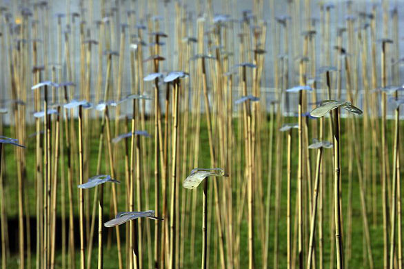 Singapore: Slippers on top of bamboo poles in the installation artwork Slipper Forest by Alfredo Aquilizan and his wife Isabel