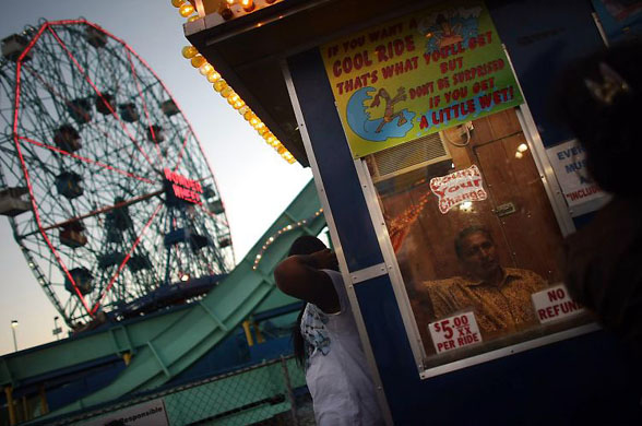 New York, US: A ticket seller in his booth on the final day of operation for Astroland Park at Coney Island