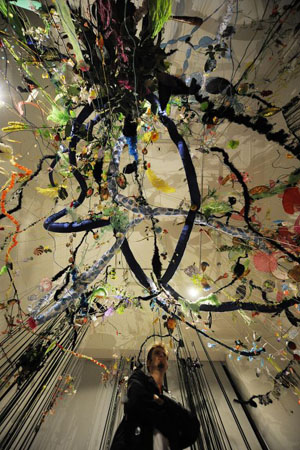 Berlin, Germany: A man looks at an installation by artists Gerda Steiner and Joerg Lenzlinger at the exhibition 'Die Tropen'