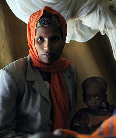 Kuyera, Ethiopia: Fayisa Tahir sits with her mother Shegitu as they wait to be discharged from a medical centre run by Medecins Sans Frontiers