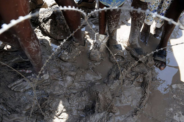 Gonaives, Haiti: People queue for food distribution by World Food Program workers
