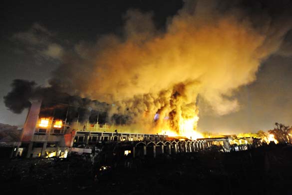 A cloud of smoke billows from the burning Marriott hotel after the powerful bomb blast