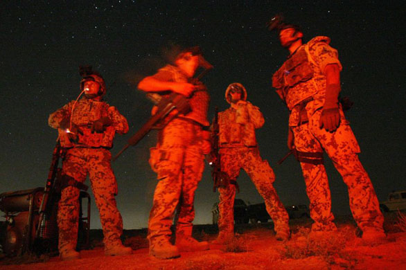 Kunduz, Afghanistan: German Bundeswehr army soldiers of the International Security Assistance Force (ISAF) stand near where they discovered an illegal weapon cache