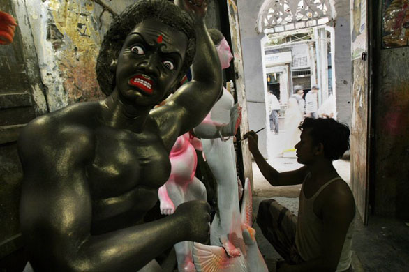 Dhaka, Bangladehs: An artisan paints the idol of a Hindu goddess at a workshop