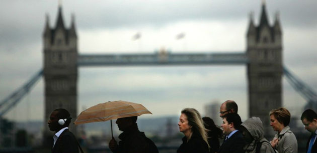 London, UK: Workers walk towards the City Of London financial district