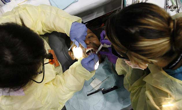 A patient receives dental treatment