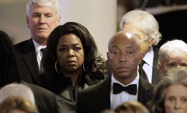 Oprah Winfrey and Russell Simmons attend the funeral