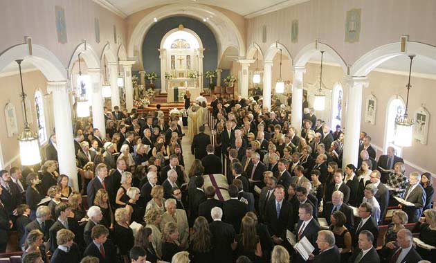 Kennedy Shriver's casket proceeds down the aisle at St Francis Xavier church