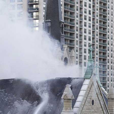 Plumes of smoke from the roof of Holy Name cathedral