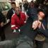 A wounded Palestinian is carried into hospital in Gaza