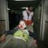 Palestinian medics carry a wounded boy into a hospital in Gaza City