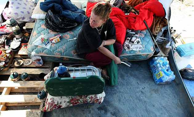 Renee Hadley sits in her tent