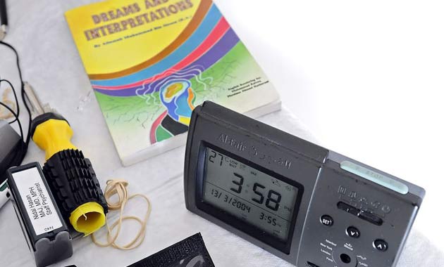 An Al-Fajr azan alarm clock sounds an Islamic prayer while sitting on a table