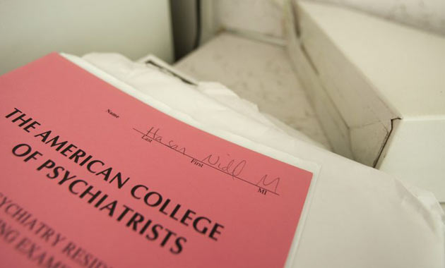 A psychiatry examination is seen in Hasan's kitchen