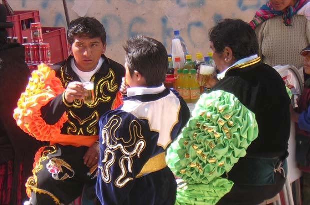 Oruro carnival Bolivia: Dancers at a drink stand