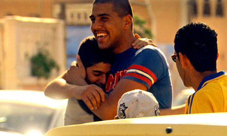 Ajami, men hugging