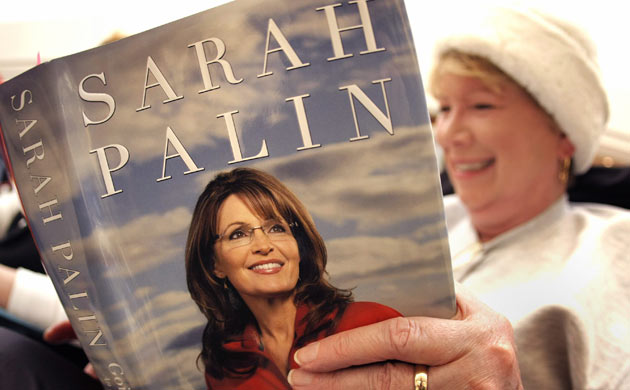An avid reader waits in line for her book to be signed by Sarah Palin