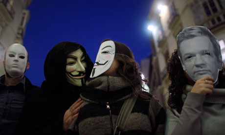 WikiLeaks Anonymous supporters wear masks during a demonstration in Malaga