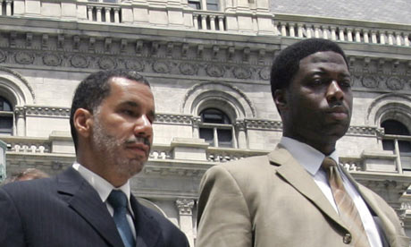 New York governor David Paterson, left, with aide David Johnson