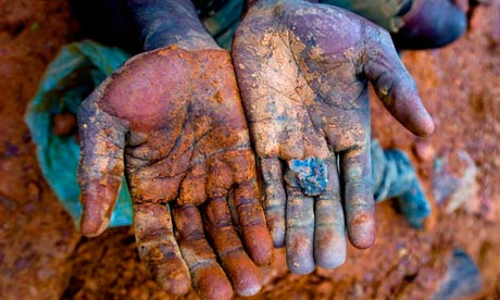 The hands of an African miner in Blood in the Mobile