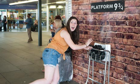 A Harry Potter fan visits  Platform 9 ¾ at King’s Cross station.