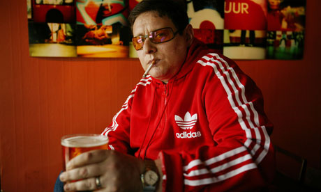Shaun Ryder holding a pint of beer