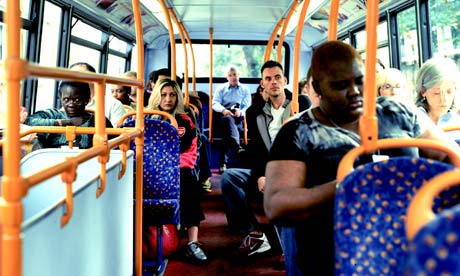 Londoners on the upper deck of a bus in the capital