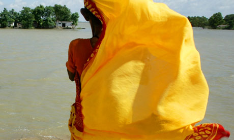 A woman's sari flutters in the wind