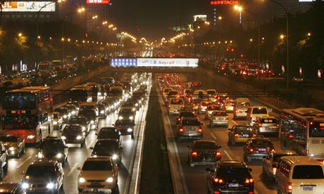 Vehicles are seen during evening traffic in Beijing