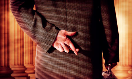 Businessman Crossing Fingers