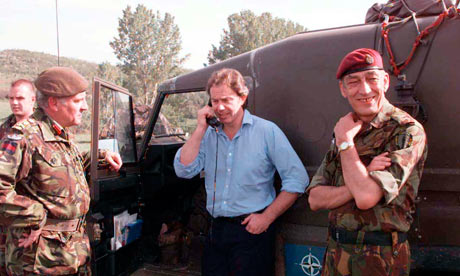Tony Blair talks to troops on the Kosovo border by phone at British army HQ, Macedonia, 3 May 1999