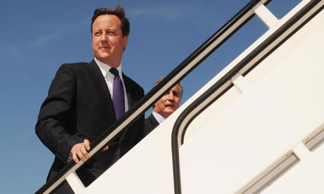Prime minister David Cameron boards a plane