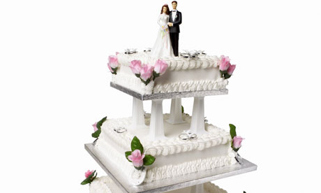 Close up view of a three tier wedding cake