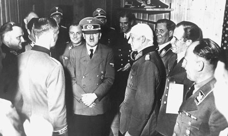 Hitler surrounded by officers following a failed assassination attempt, 20 July 1944.
