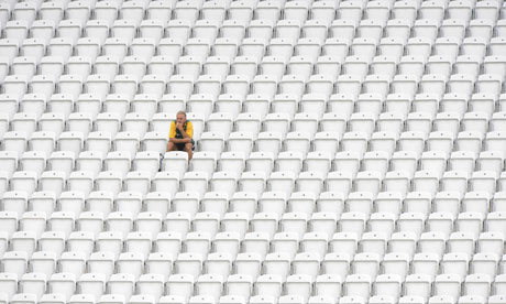 One man among rows of empty seats