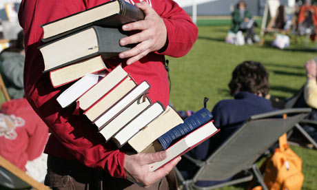 Carrying a pile of books