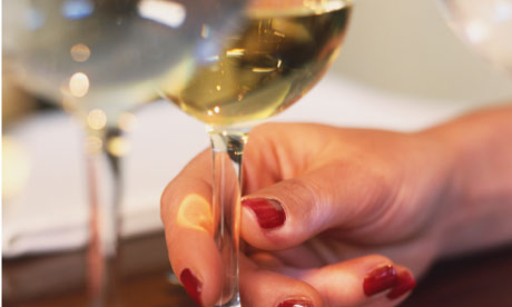 hand holding wine glass