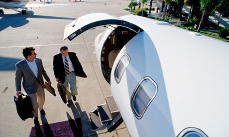 Two businessmen boarding a private jet