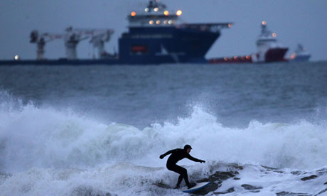 A surfer braves the waters of the North Sea off The Esplanade, Aberdeen