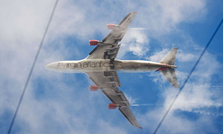 A passenger plane comes into land at Heathrow airport