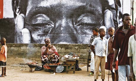 A poster created by French ‘urban artivist’ JR adorns a public space in Sierra Leone.