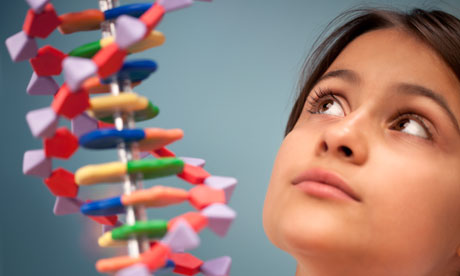 A schoolgirl looks up in amazement at a DNA molecule